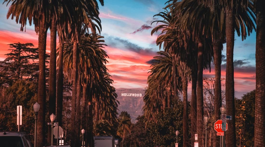 Image of a Hollywood street during sunset with the Hollywood sign